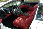 All red interior changed to a black two tone combination with all black dash carpet and back panels.